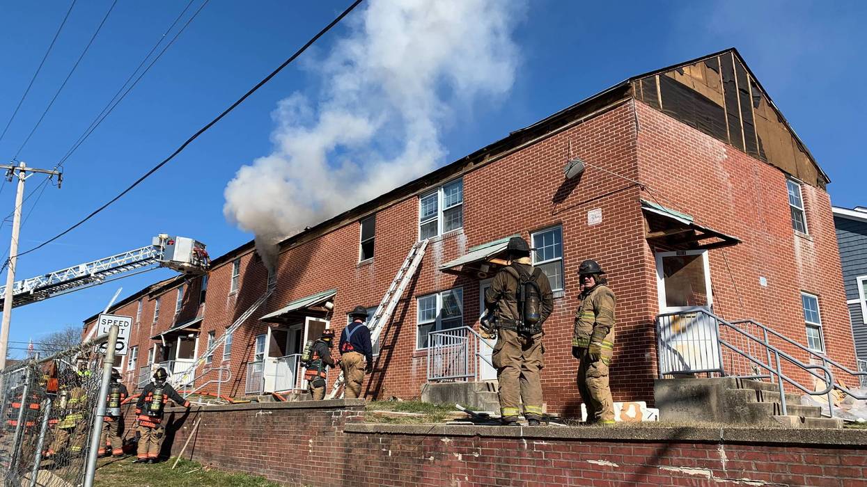 Montgomery County firefighters take part in a rare live fire training session at an eight-home complex in Upper Dublin scheduled for demolition.