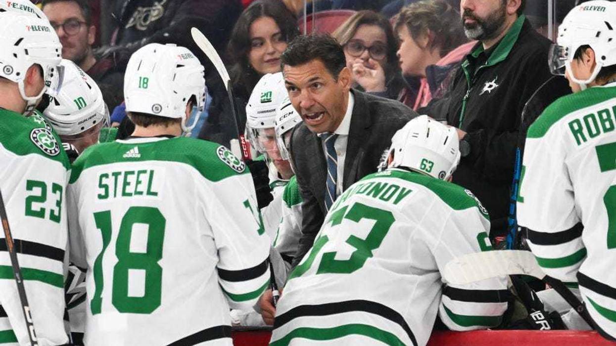 MONTREAL, CANADA - FEBRUARY 10: Assistant coach of the Dallas Stars Alain Nasreddine speaks to his team during the third period against the Montreal Canadiens at the Bell Centre on February 10, 2024 in Montreal, Quebec, Canada. The Dallas Stars defeated the Montreal Canadiens 3-2.