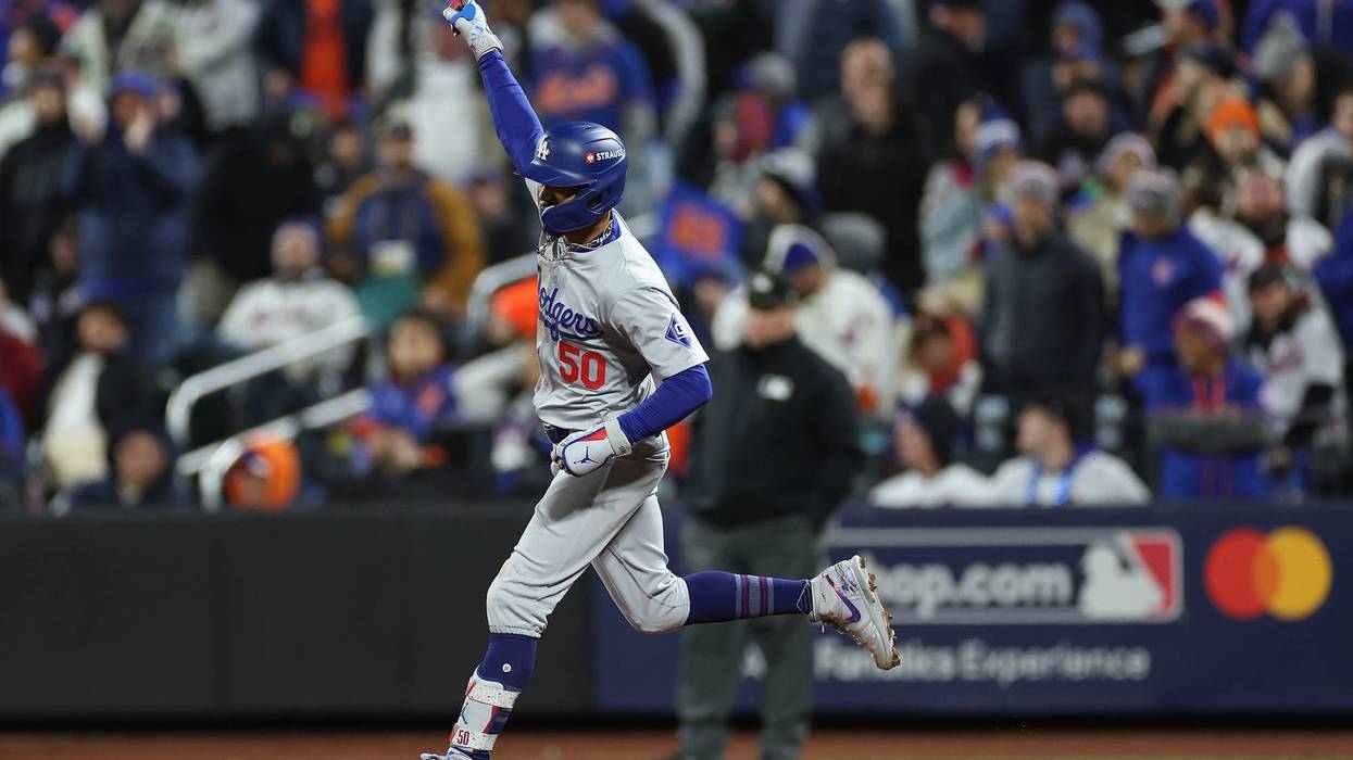 Mookie Betts #50 of the Los Angeles Dodgers celebrates a two run home run during the sixth inning against the New York Mets during Game Four of the National League Championship Series at Citi Field on October 17, 2024 in New York City.