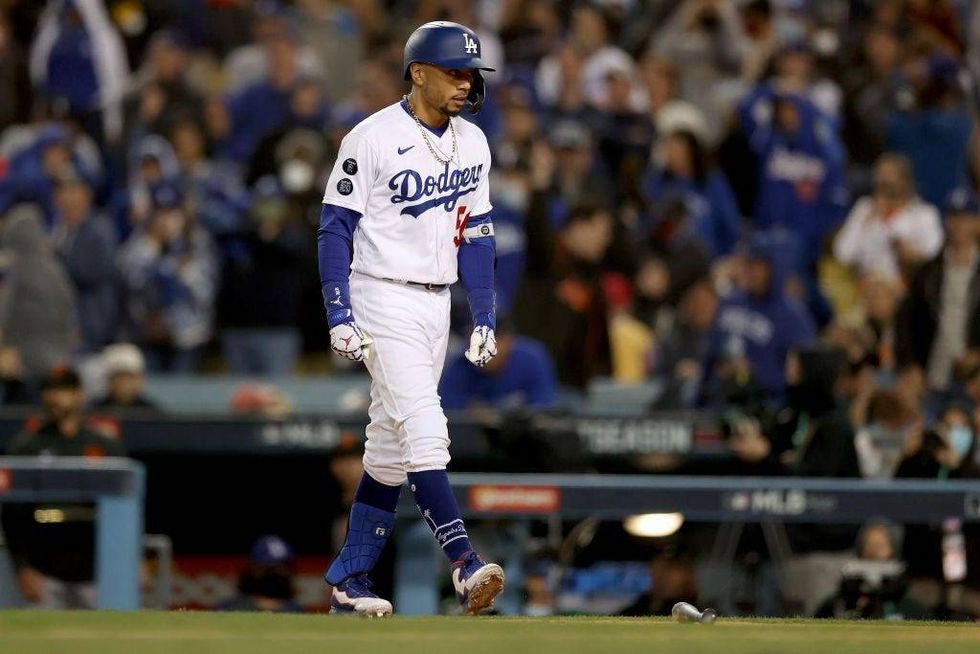 Mookie Betts #50 of the Los Angeles Dodgers reacts after a line out against the San Francisco Giants during the seventh inning in game 3.