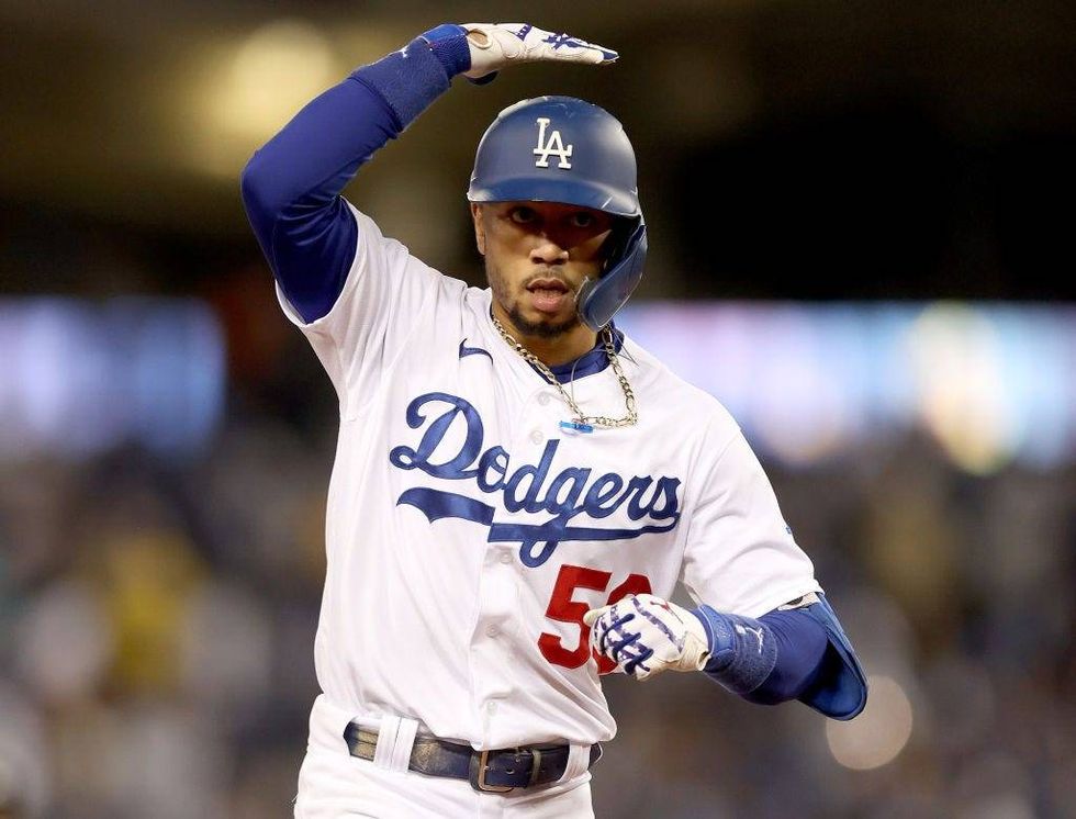 Mookie Betts #50 of the Los Angeles Dodgers reacts after his two run home run against the San Francisco Giants during the fourth inning in game 4.