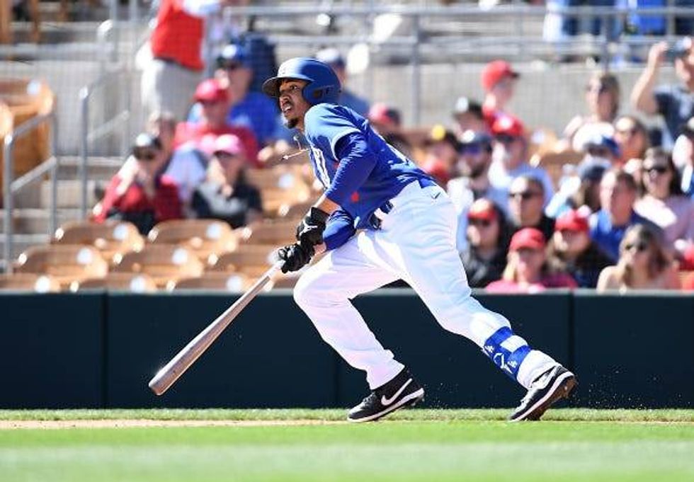 Mookie Betts picks up a hit in a Dodgers spring training game.
