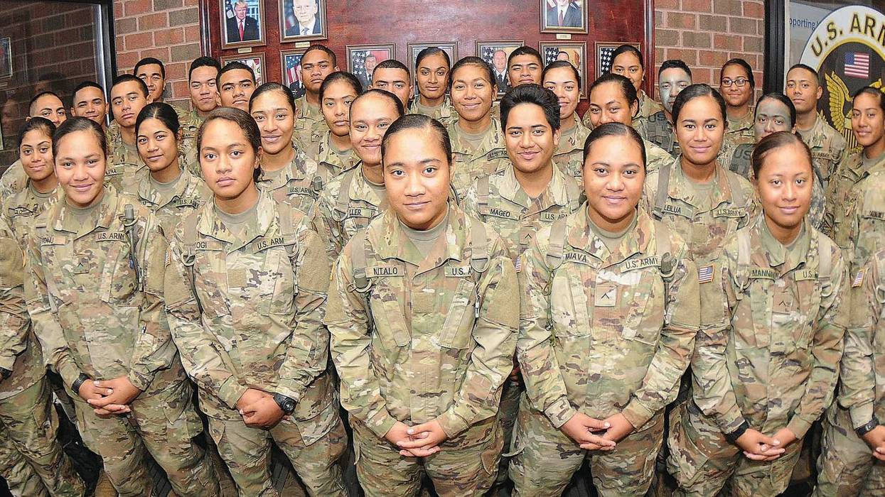 More than 30 members of an American Samoa family pose for pictures at Thompson Hall, Fort Lee, Va.