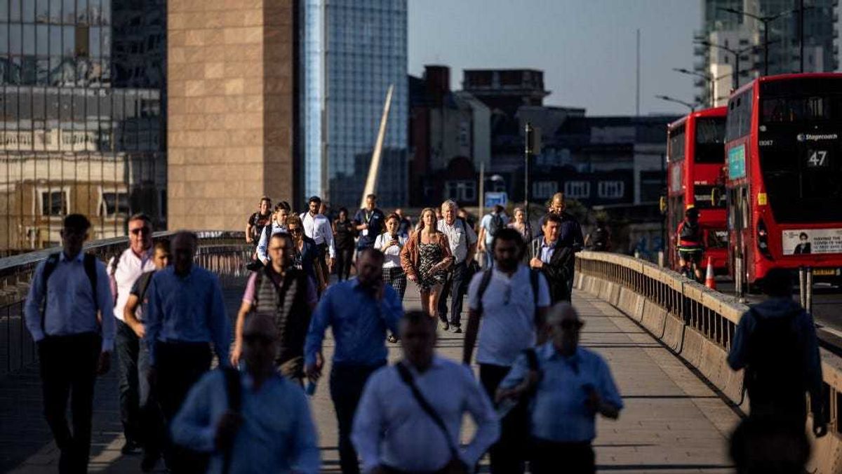 Morning commuters cross London Bridge on June 14, 2021 in London, England.