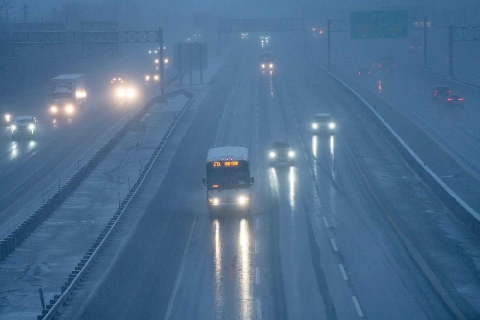 Morning commuters navigate the snow on the New Jersey Turnpike in Ridgefield on Feb. 13, 2024