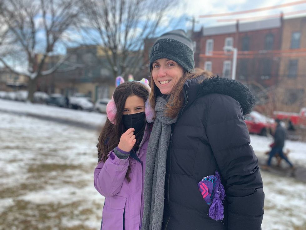 Mother and daughter in snow
