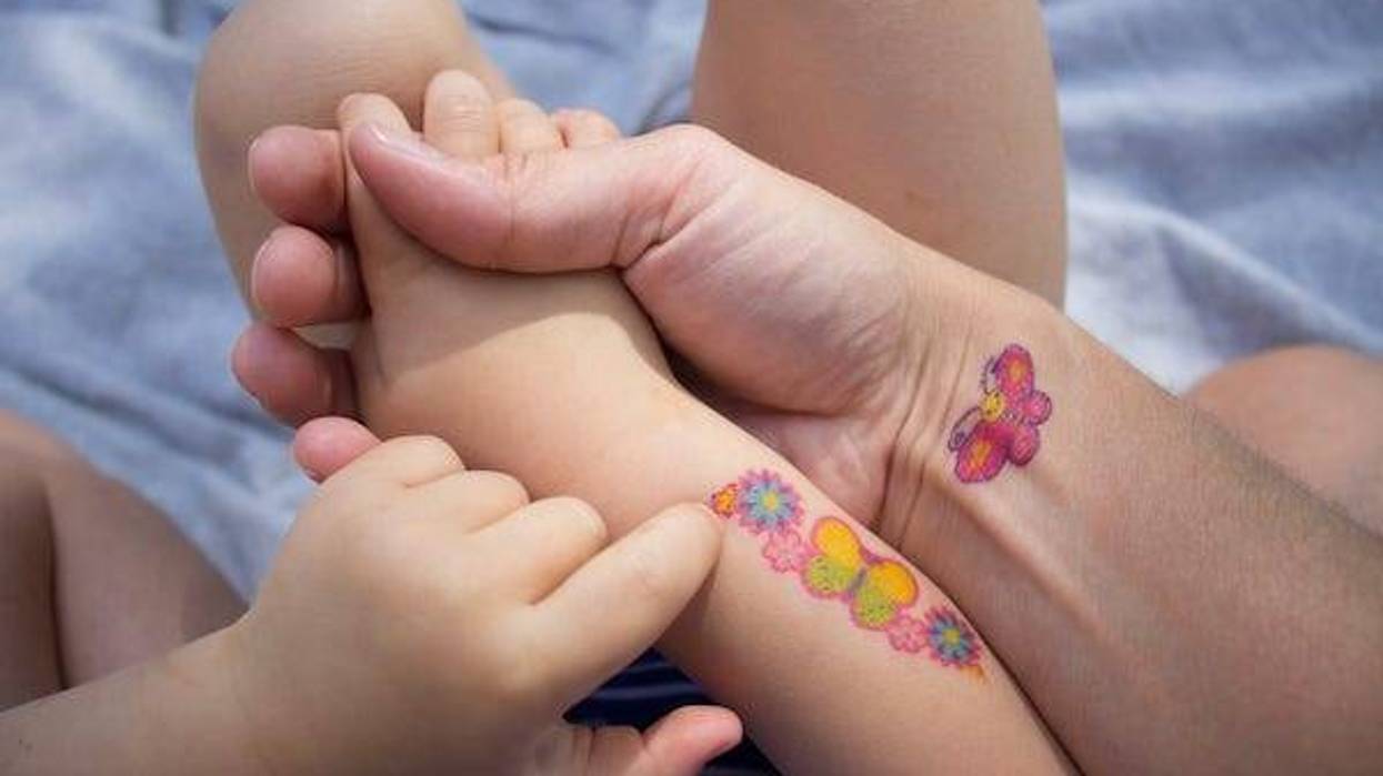 Mother and daughter with temporary tattoos