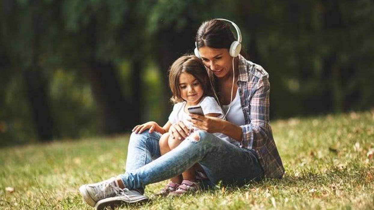 mother and son with headphones on