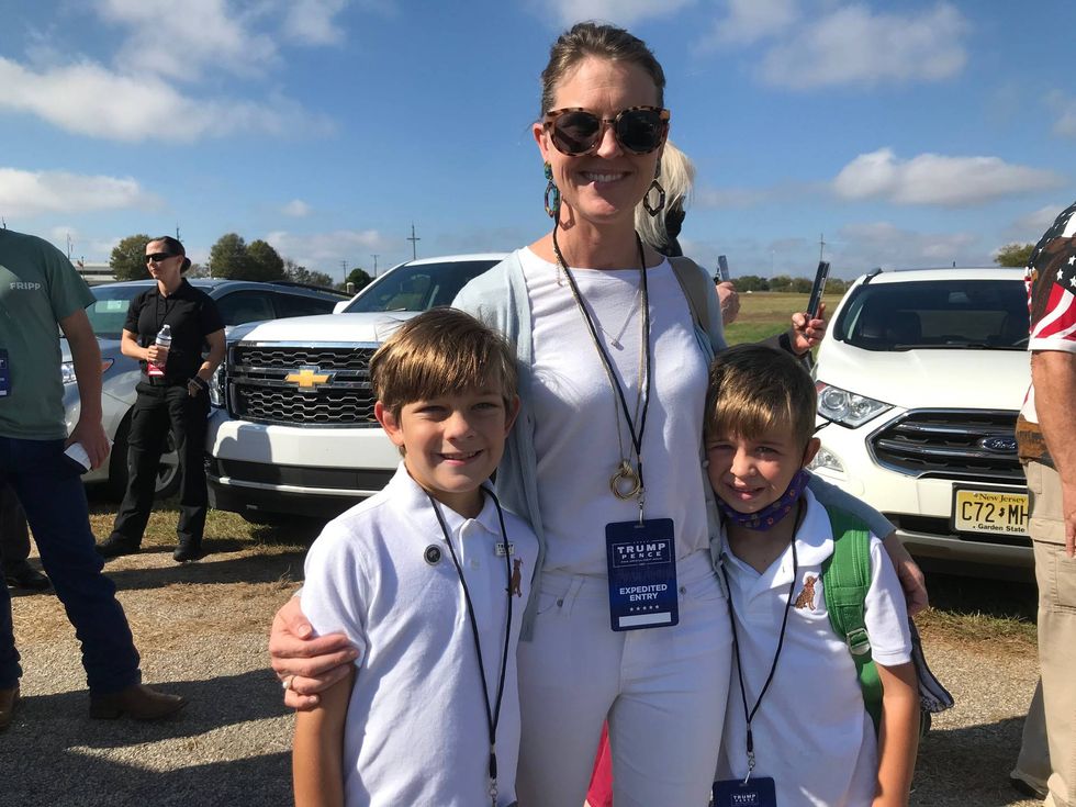 Mother and sons arrive early to ensure seats to see Vice President