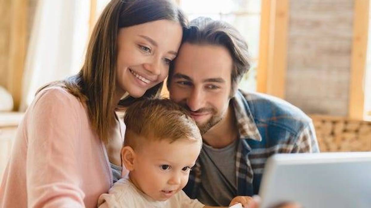 Mother, father, and child taking a selfie