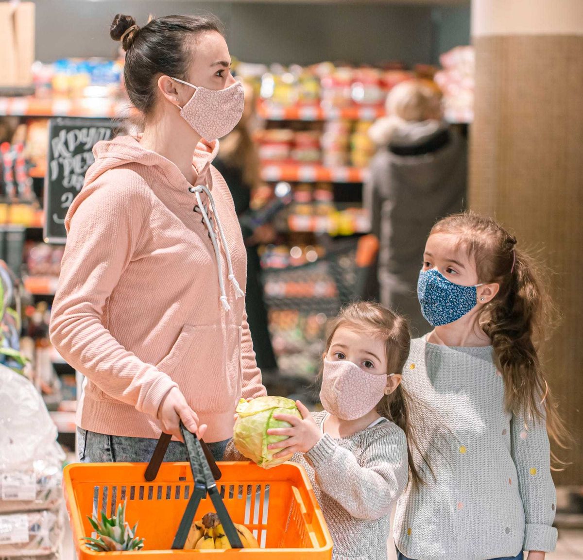 Mother shopping with her children.