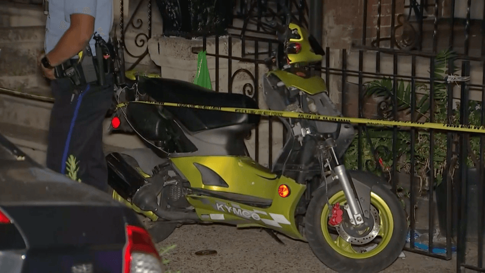 motorbike parked outside front porch in crime scene tape