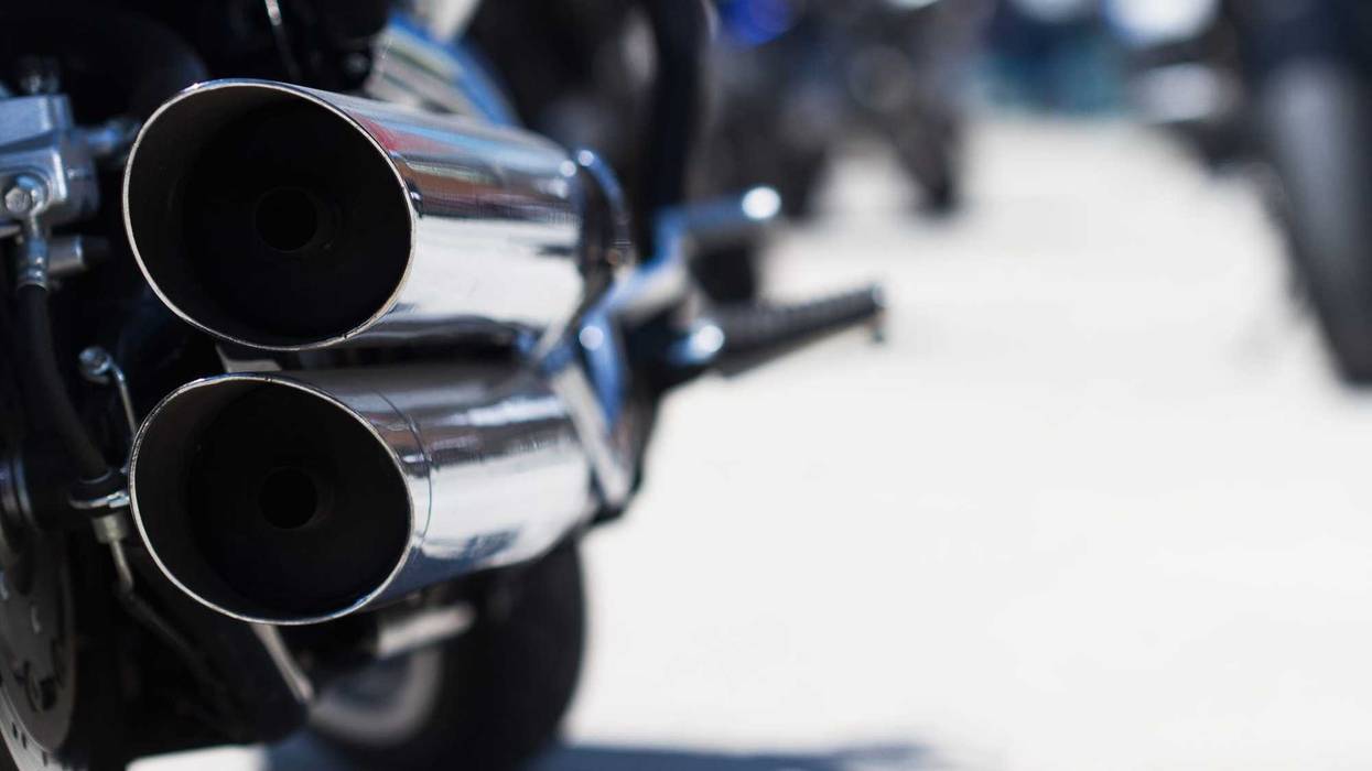 Motorcycle exhaust pipe stock photo.