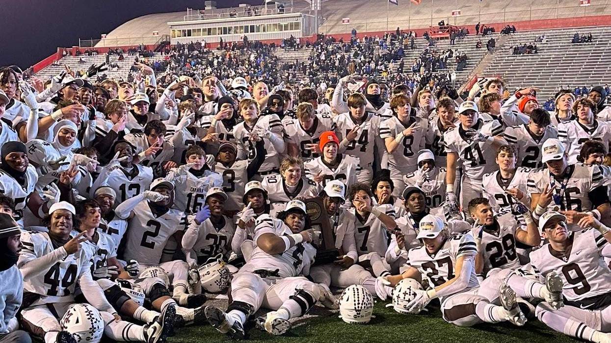 Mount Carmel football team poses for a photo after winning the 2023 IHSA 7A Championship