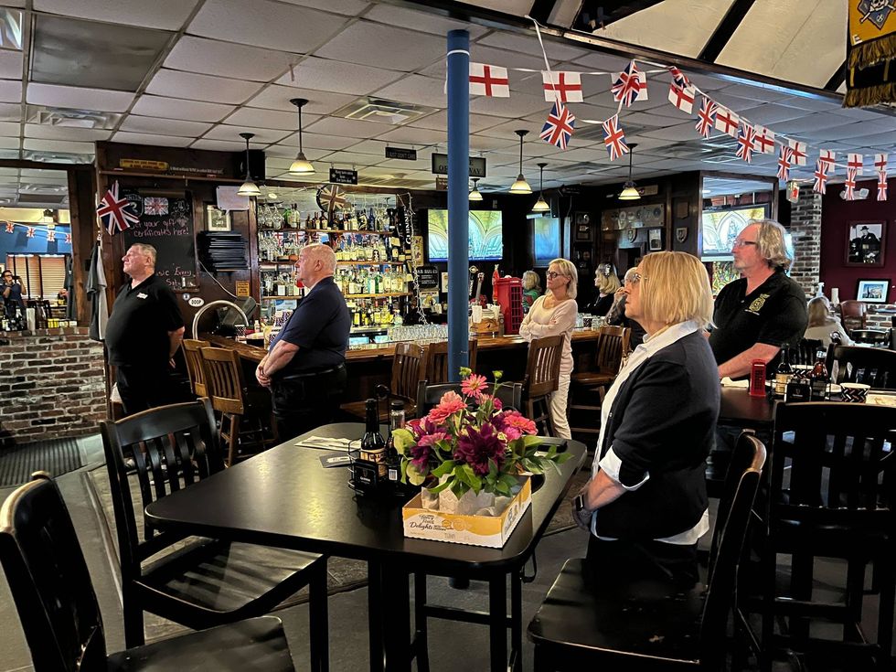 Mourners gather at Wilmington pub before dawn to watch Queen Elizabeth