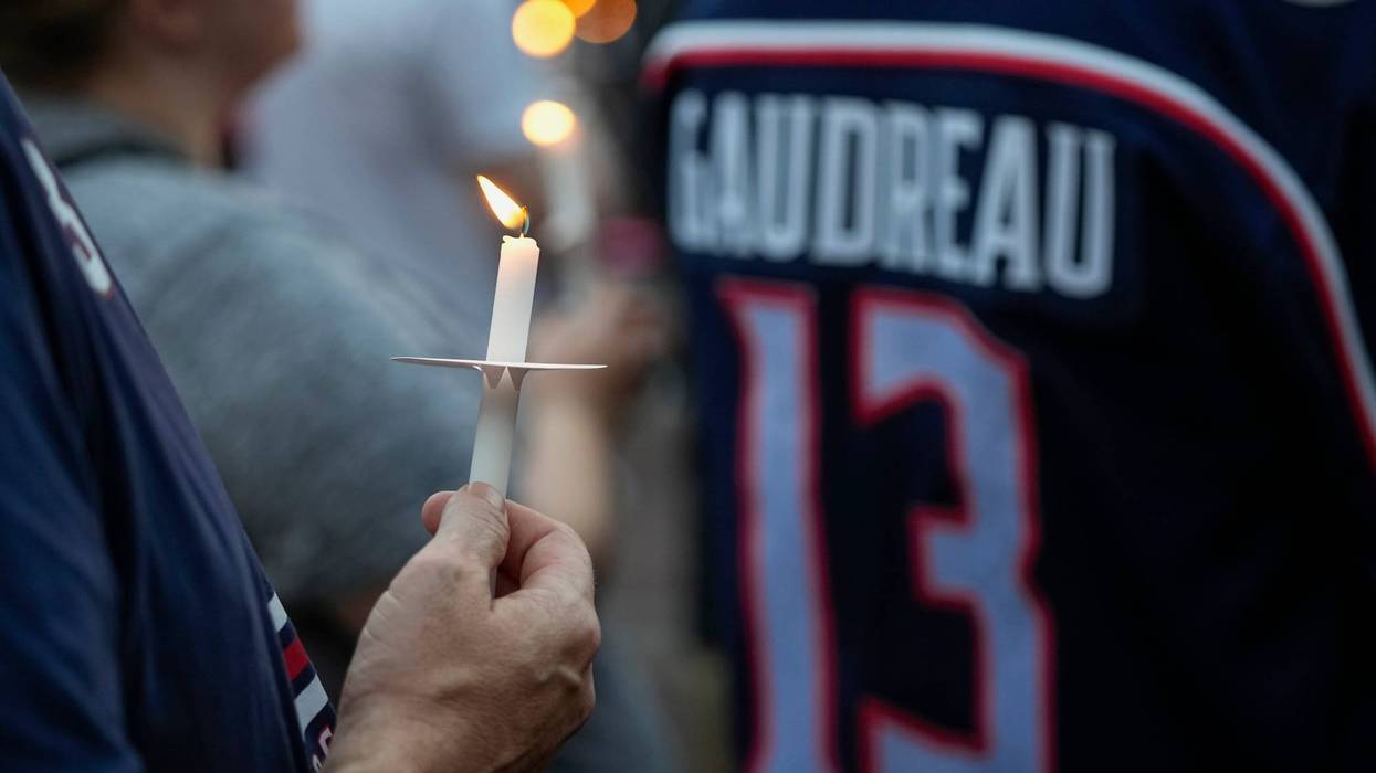 Mourners gather for a candlelight vigil to remember Columbus Blue Jackets forward Johnny Gaudreau at Nationwide Arena