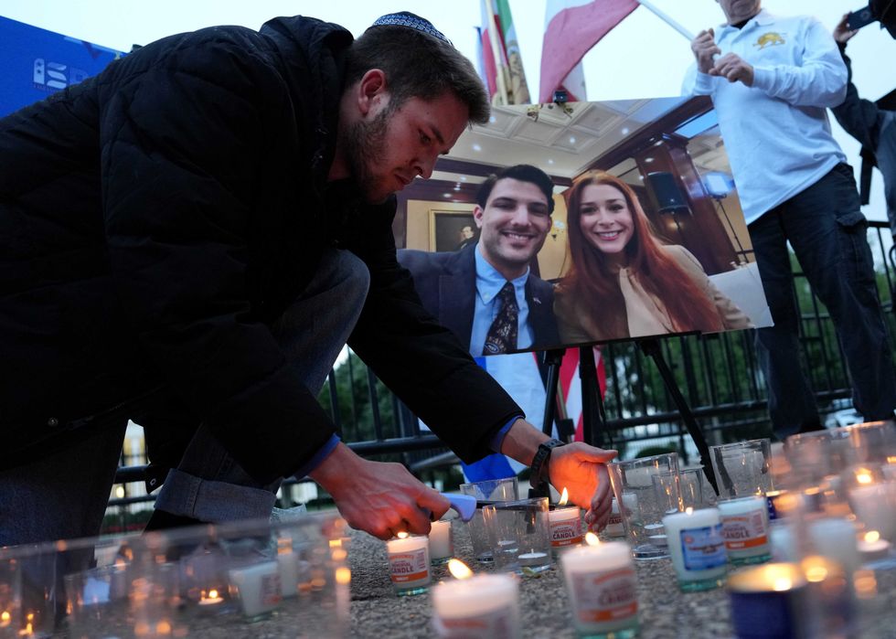 Mourners lights candles during a vigil outside of the White House on May 22, 2025 in Washington, DC. Two Israeli Embassy staff members, Yaron Lischinsky and Sarah Lynn Milgrim, were gunned down after an event at the museum by a man shouting slogans in support for Palestine.