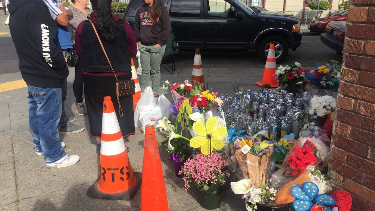 Mourners stopped at a roadside shrine in Oakland for a mother and her six-year-old son who were fatally struck by a hit-and-run driver on Foothill Boulevard on April 13, 2019.