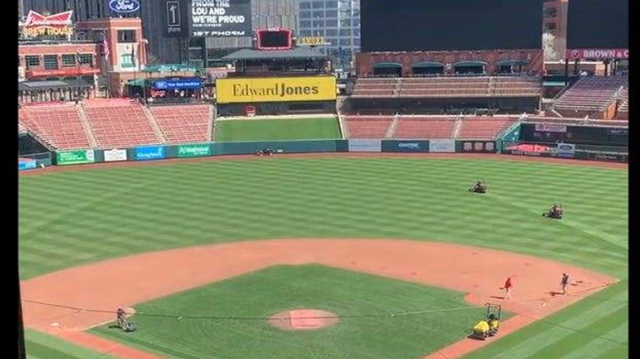 Mowing the arch into the new grass turf at Busch Stadium.