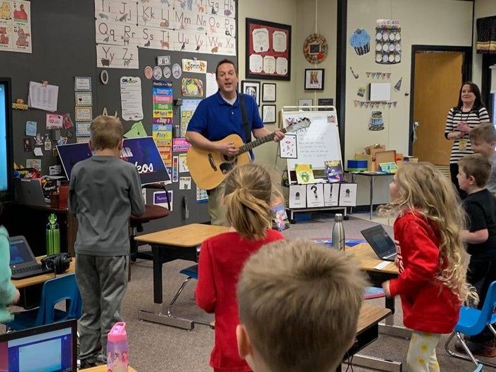 Mr. Krokos singing with class