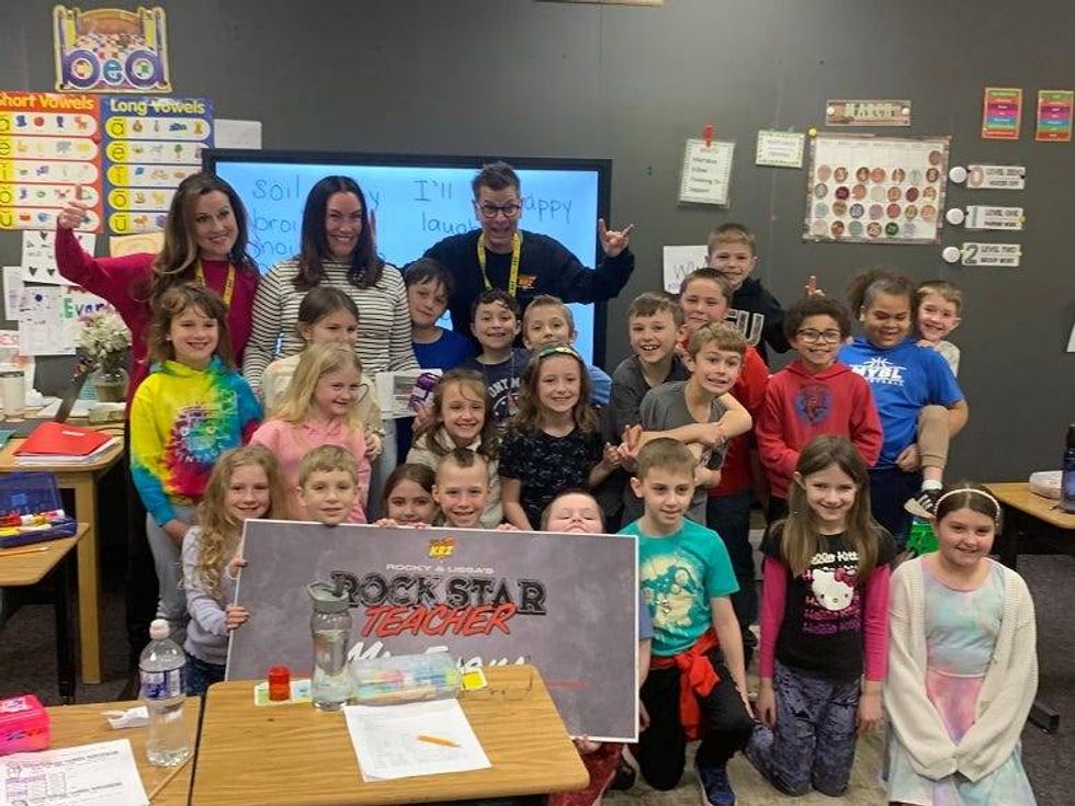 Ms. Evans with her students and Rocky & Lissa