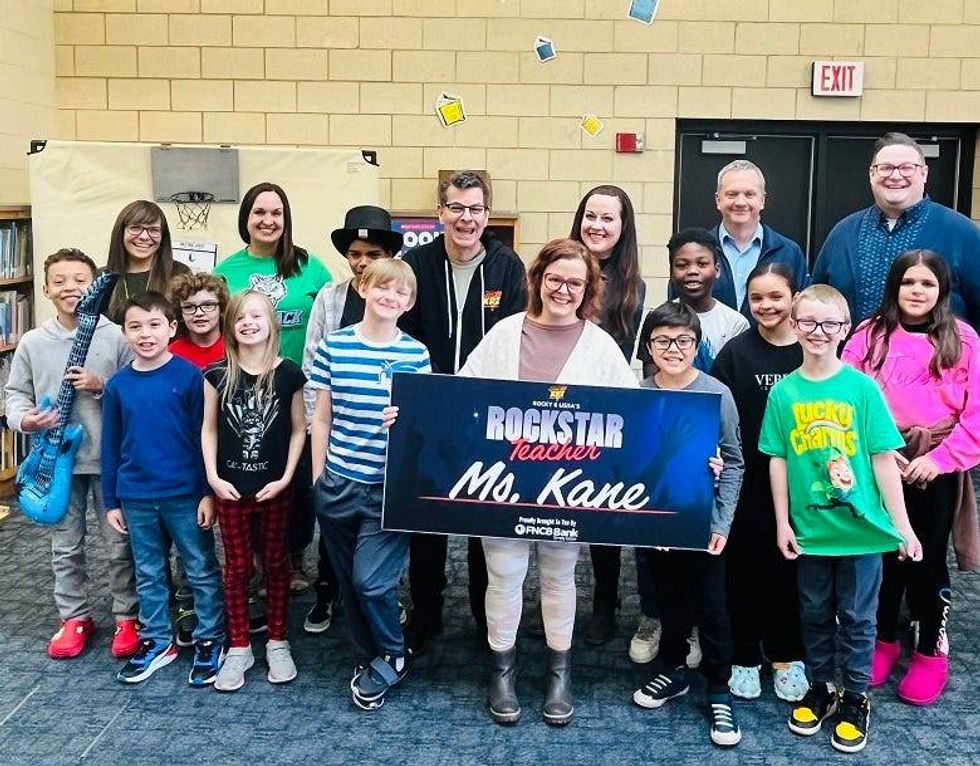 Ms. Kane & her students with Mike Cummings from FNCB Bank and Principal Correll