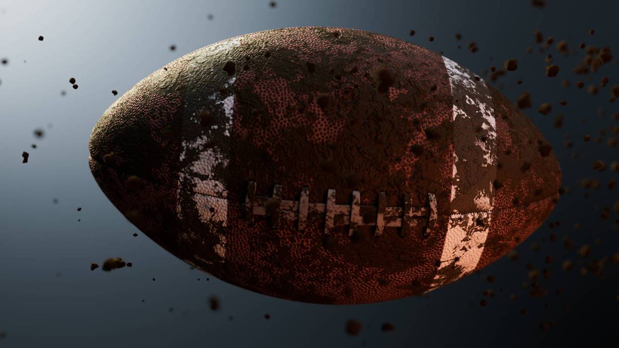 Muddy American Football In Slow Motion