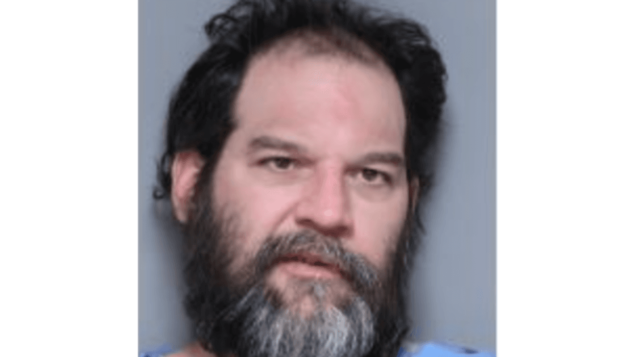 Mugshot of guy with greying beard