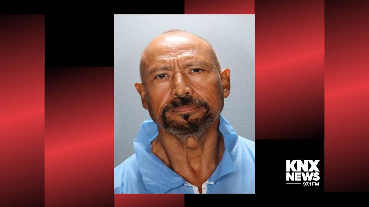 mugshot of latino man with bald head and graying goatee