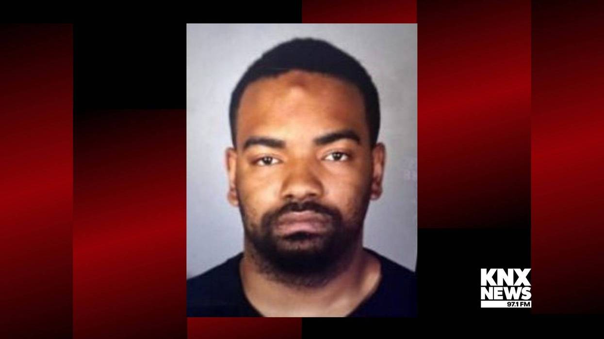 mugshot of young black man with facial hair