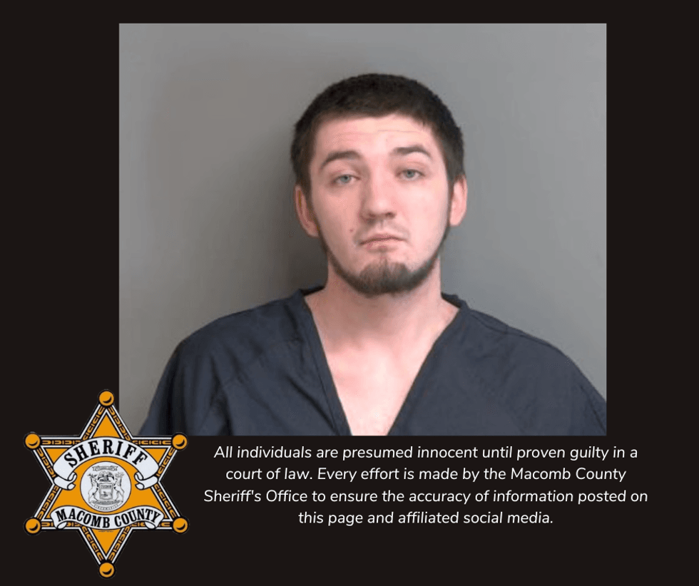 Mugshot of young, dark-haired man