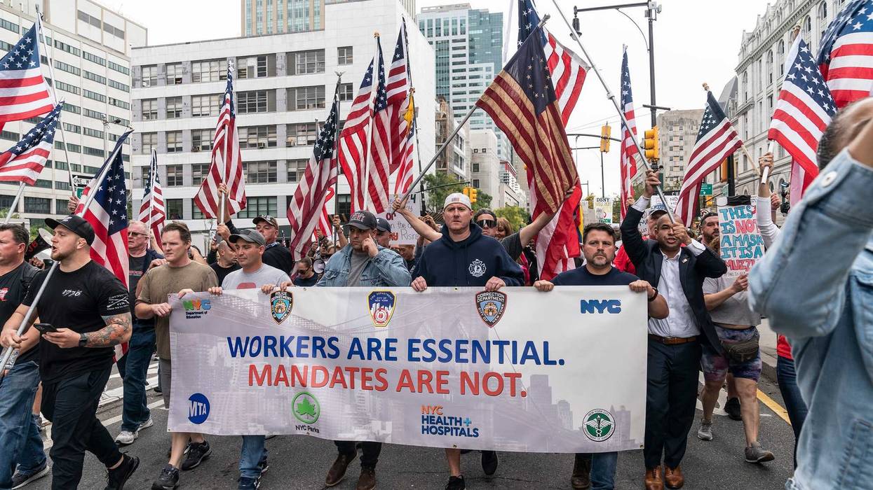 Municipal workers of the city march across Brooklyn bridge and rally at City Hall Park against vaccination mandate.