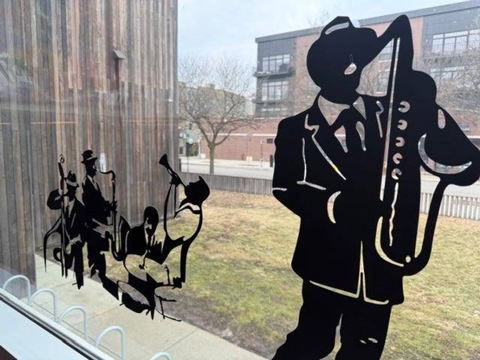 Murals on the windows of Black Ensemble Theater