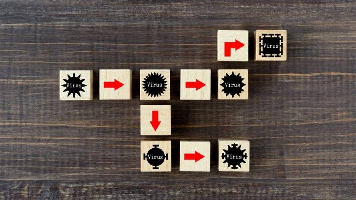 Mutation of virus images, wooden blocks with virus pictogram and red arrow