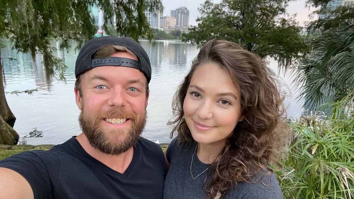 My wife and I posing in front of Lake Eola