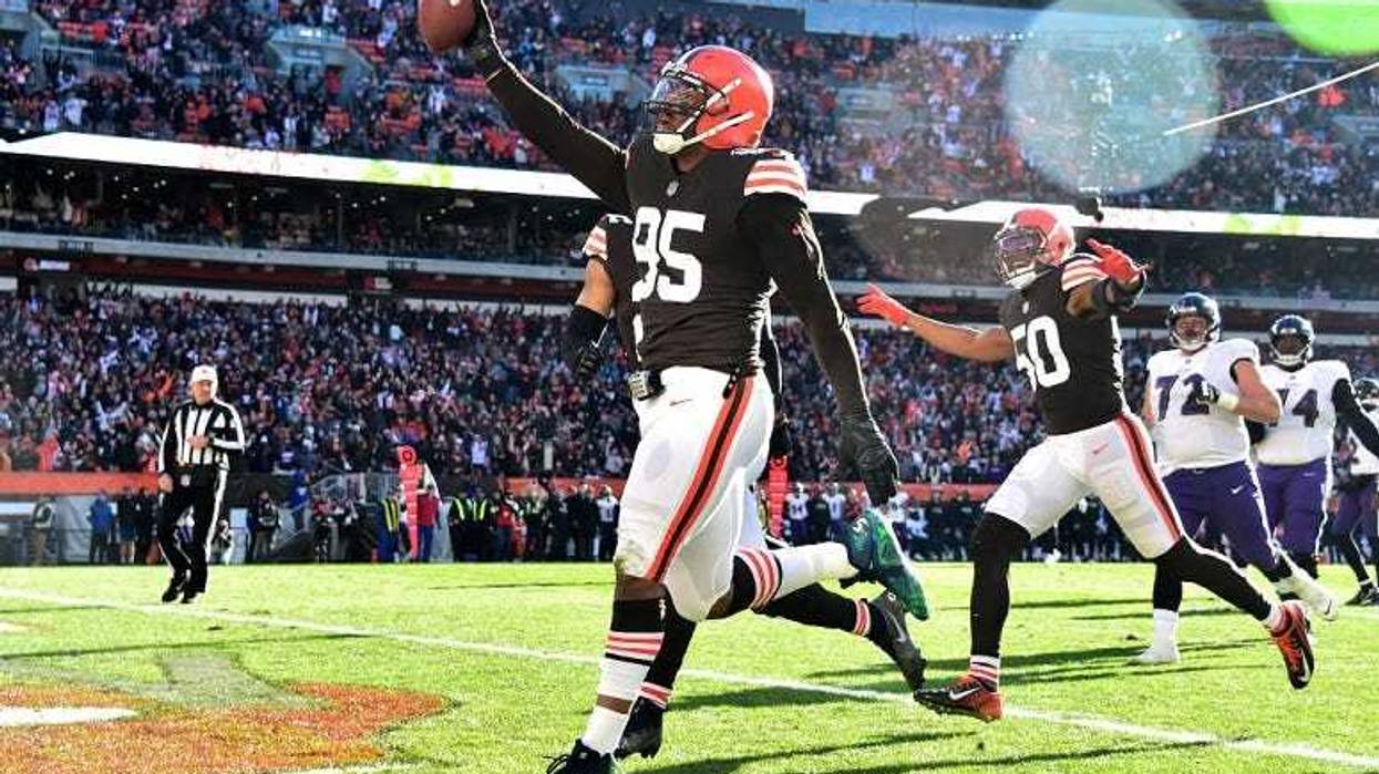 Myles Garrett celebrates after running the ball in for a touchdown after a fumble recovery against the Baltimore Ravens