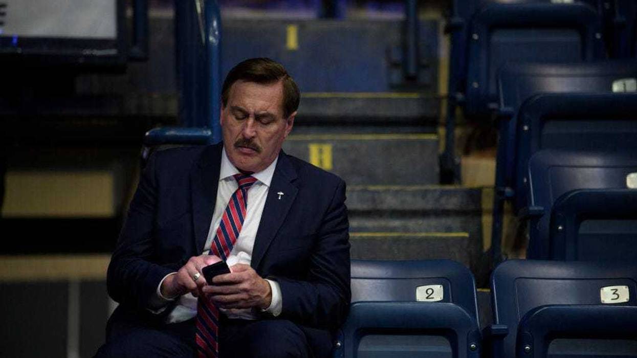 MyPillow CEO Mike Lindell checks his cellphone inside the Covelli Centre before a Save America Rally, featuring former President Donald Trump, to support Republican candidates running for state and federal offices on September 17, 2022 in Youngstown, Ohio.