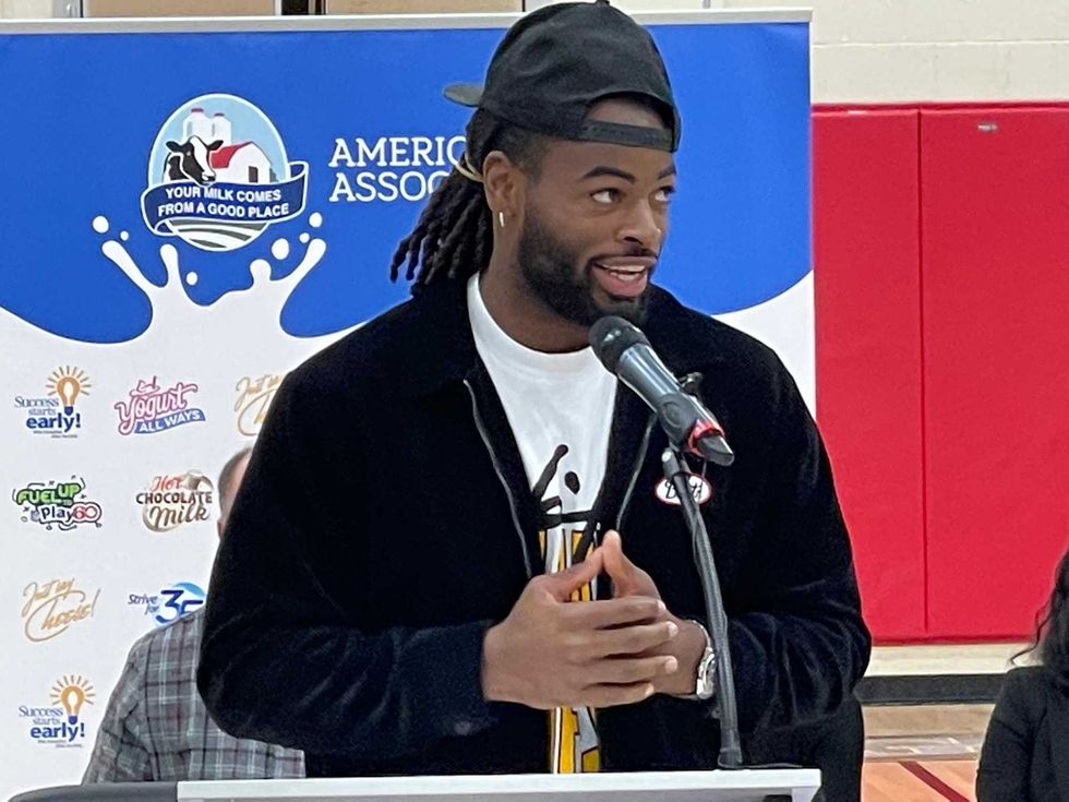 Najee Harris at a podium