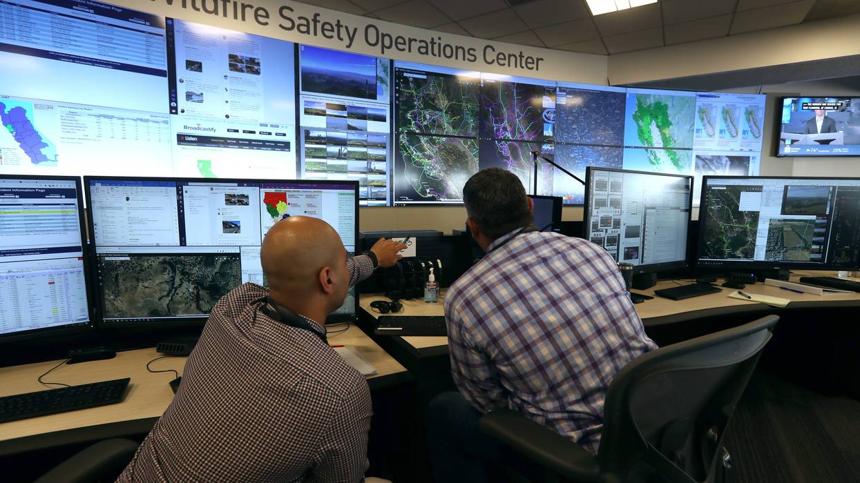 nalysts at the Pacific Gas and Electric (PG&E) Wildfire Safety Operations Center monitor a wildfire on August 05, 2019 in San Francisco, California.