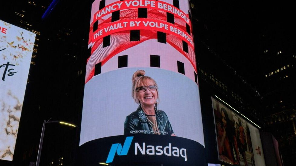 Nancy Volpe Beringer is shown on a Times Square billboard.