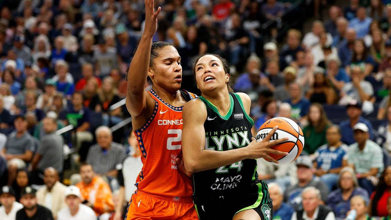 Napheesa Collier #24 of the Minnesota Lynx drives to the basket against Alyssa Thomas #25 of the Connecticut Sun during the WNBA Playoffs at Target Center.