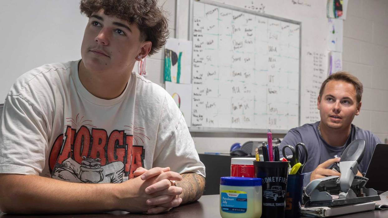 Nashville Christian quarterback Jared Curtis, left, reviews film with offensive coordinator Kyle Tidwell at the team’s locker room Tuesday, Oct. 14, 2025.