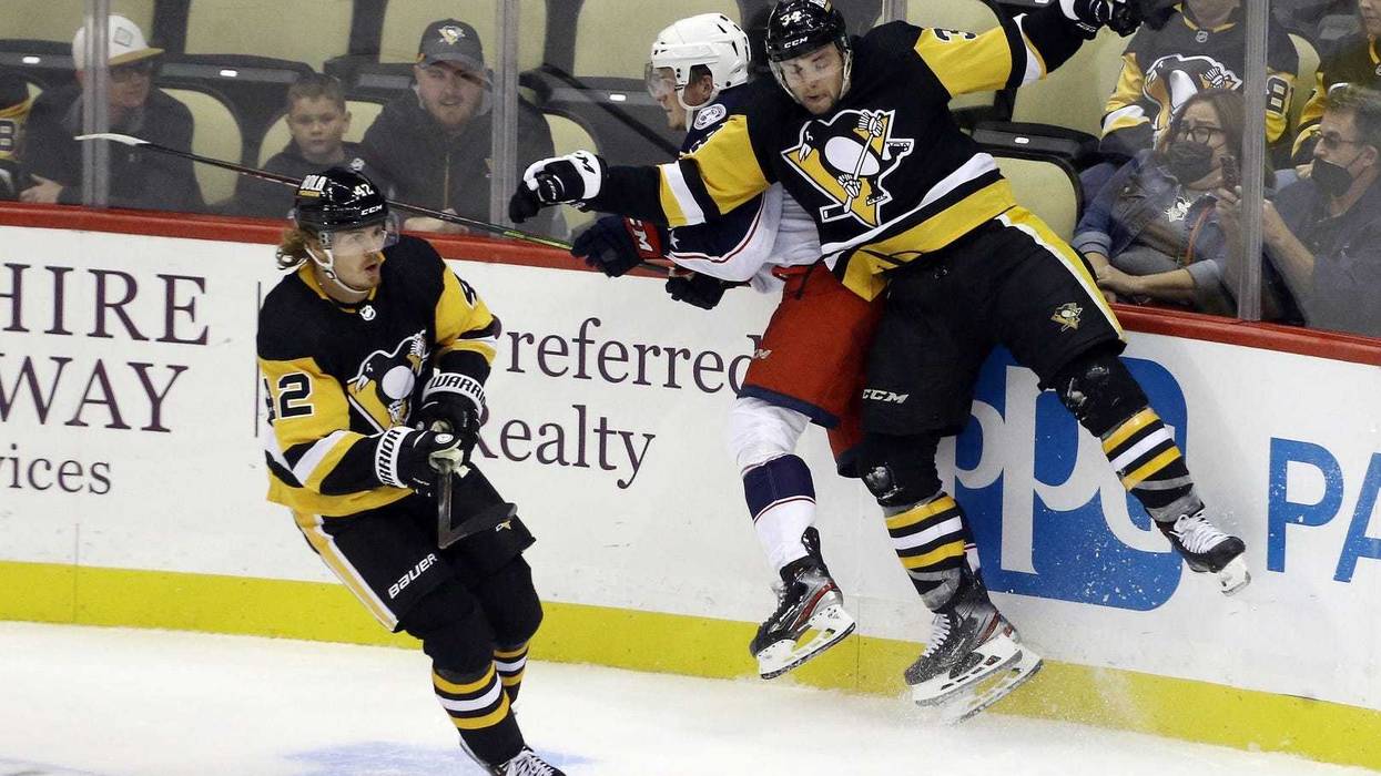 Nathan Legare slams a Blue Jacket into the boards