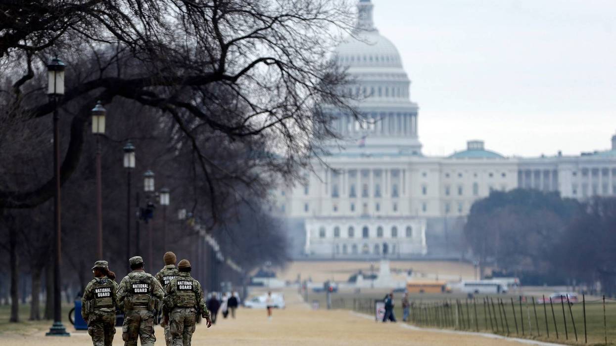 National Guard patrol the Washington Mall, with the U.S. Capitol in the background, Friday, Jan. 9, 2026, in Washington.