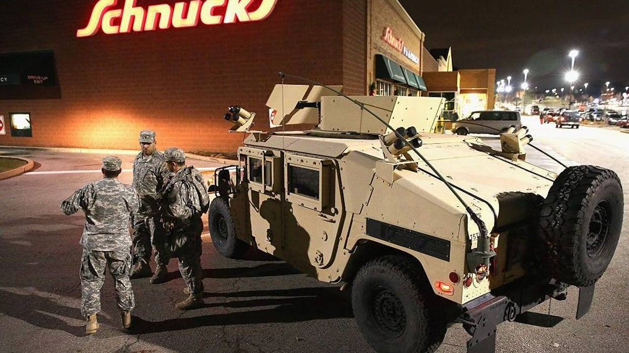 National Guard troops arrive ahead of the grand jury announcement in the Michael Brown shooting case on November 24, 2014 in Ferguson, Missouri.
