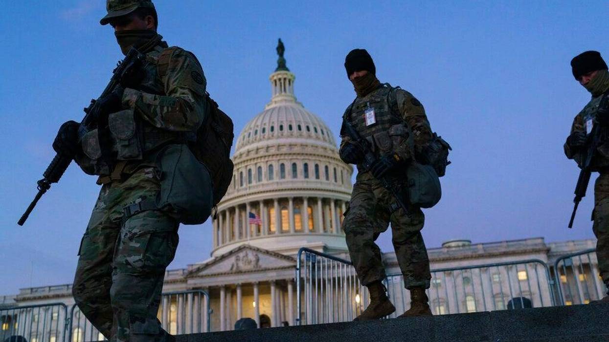 National Guard troops reinforce the security zone on Capitol Hill in Washington, Tuesday, Jan. 19, 2021, before President-elect Joe Biden is sworn in as the 46th president on Wednesday. (AP Photo/J. Scott Applewhite)