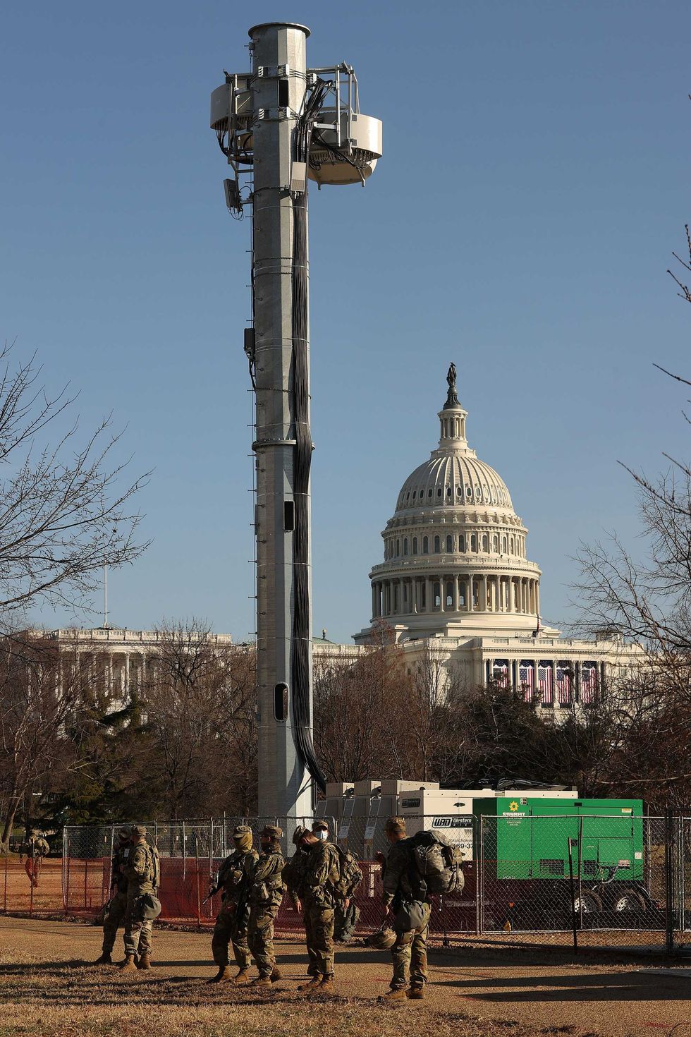 National Guard troops stand watch at the base of a communications tower on the West Front of the U.S. Capitol the day after the House of Representatives voted to impeach President Donald Trump for the second time January 14, 2021 in Washington, DC. Thousands of National Guard troops have been activated to protect the nation