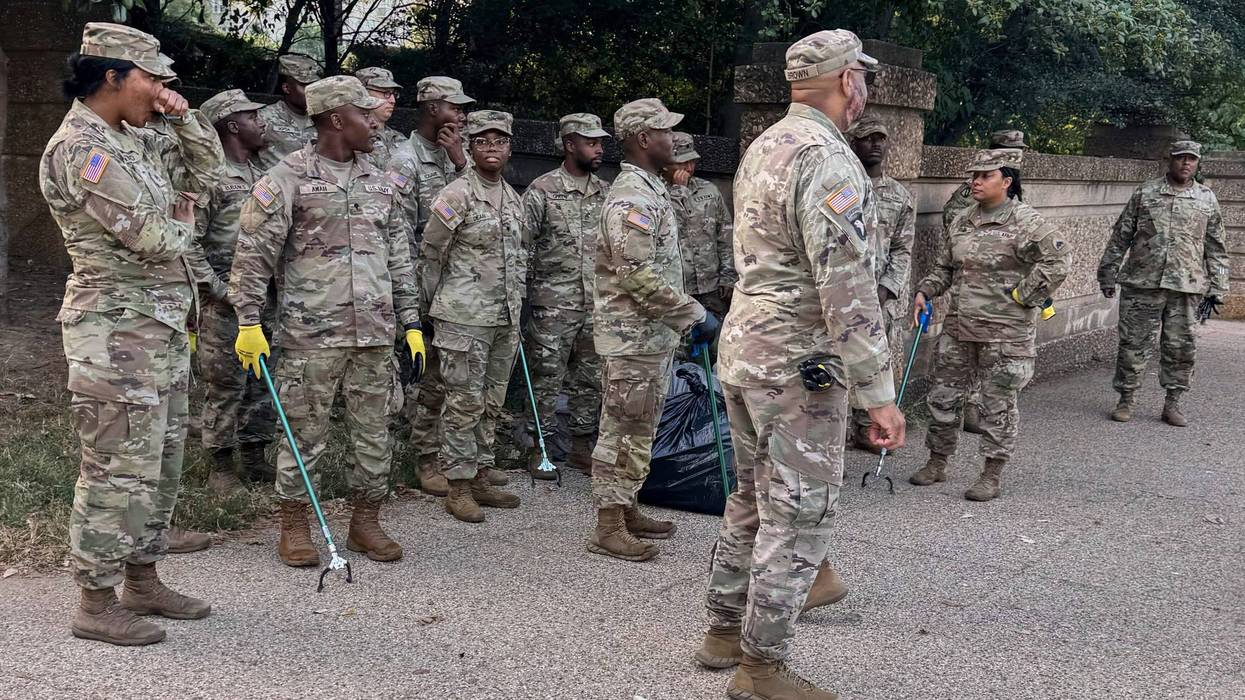 National Guard with tools to pick up trash are seen Tuesday, Sept. 2, 2025 at Meridian Hill Park, in Washington.
