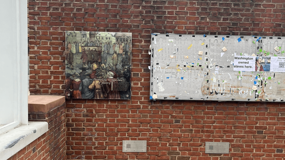 National Park Service workers reinstall the slavery displays to the President