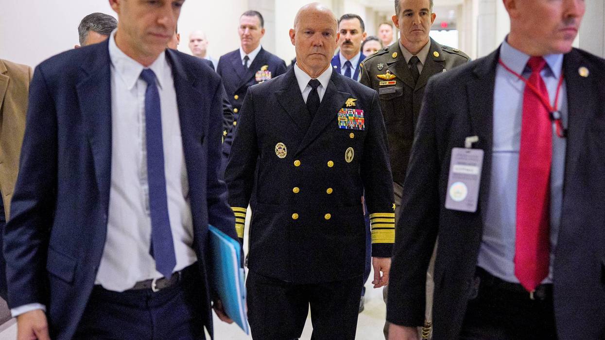 Navy Adm. Frank Bradley (C) arrives for a closed door classified meeting with lawmakers on Capitol Hill on December 4, 2025 in Washington, DC. Members of the Senate and House Armed Services committees meet with Bradley about the strikes on suspected drug boats out of Venezuela ordered by the Trump Administration